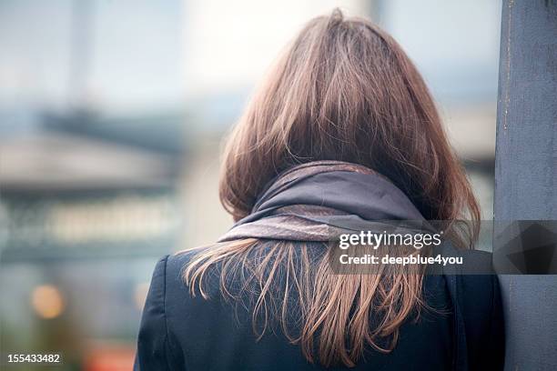 woman with neckerchief - back of head stockfoto's en -beelden