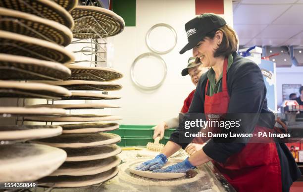 Shadow chancellor Rachel Reeves makes pizza at Papa Johns during a visit to Haven Primrose Valley Holiday Park in Filey, North Yorkshire. Picture...