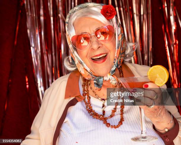 grandmother with a cocktail in a party - bloody mary stock pictures, royalty-free photos & images