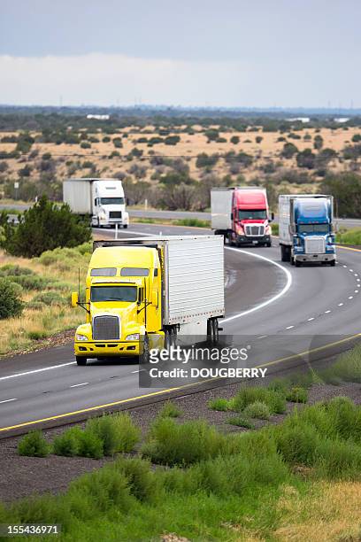 trucking industry - convoy stock pictures, royalty-free photos & images