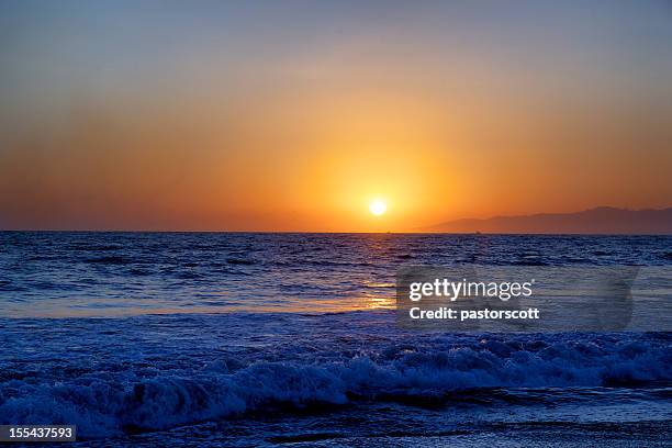 sunset of southern california summer sky sun ocean waves - dark blue stock pictures, royalty-free photos & images