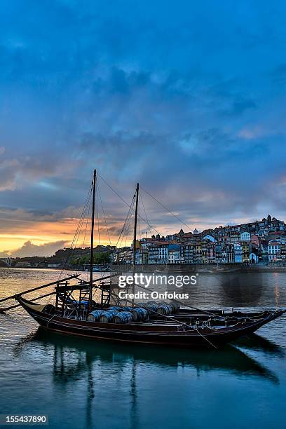 porto at sunset with rabelo boats on douro river - river douro stock pictures, royalty-free photos & images