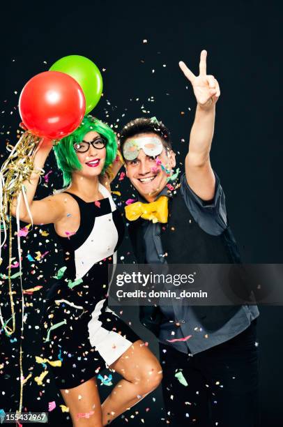 young couple celebrating new years day, party or carnival - balloon fiesta stock pictures, royalty-free photos & images