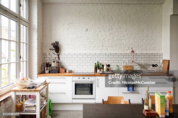 sunny white european kitchen - domestic kitchen stock pictures, royalty-free photos & images