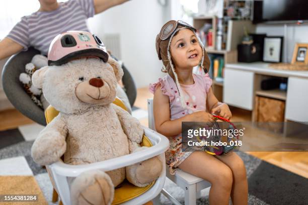 teddy bear and girl aircrew - aviator glasses stock pictures, royalty-free photos & images