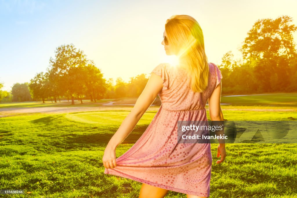 Attractive girl enjoying the sunset