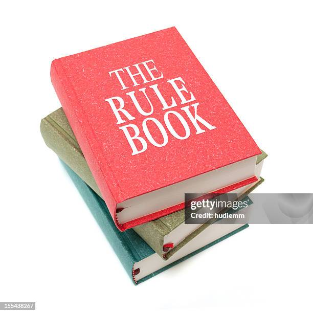 the rule books isolated on white background - instruction manual stockfoto's en -beelden