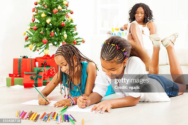 children drawing and coloring to santa claus. - christmas colouring stock pictures, royalty-free photos & images