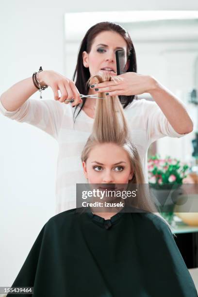 young woman in hair salon - hand holding hair dryer stock pictures, royalty-free photos & images