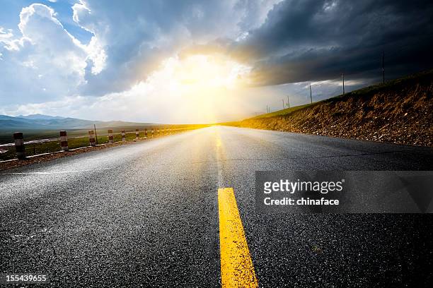 road thunderstorm - the end stock pictures, royalty-free photos & images