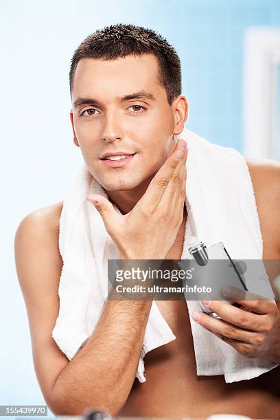 handsome man after shave - aftershave stock pictures, royalty-free photos & images