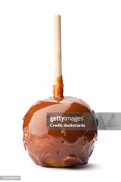 caramel apple on a stick - taffy apple stock pictures, royalty-free photos & images