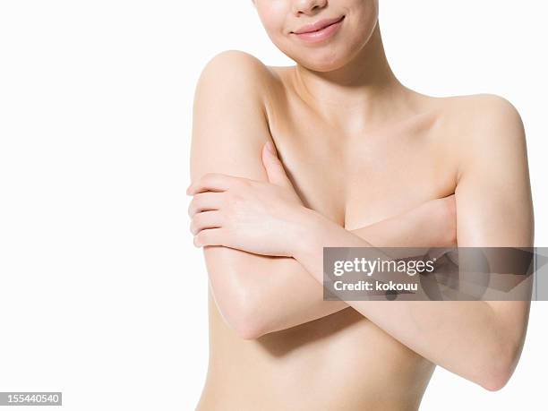 desnudo mujer y de su mano a una de las mamas - perfect female body shape fotografías e imágenes de stock