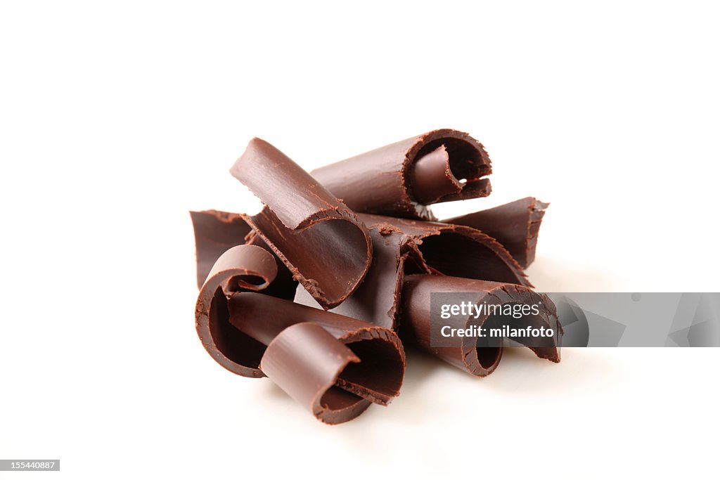 Group of chocolate curls on a white background