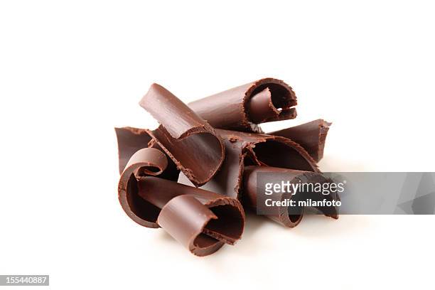 group of chocolate curls on a white background - chocolate stock pictures, royalty-free photos & images