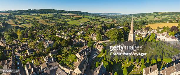 idyllic cotswold village church homes country aerial panorama - stroud gloucestershire stock pictures, royalty-free photos & images