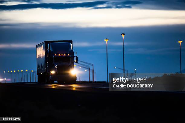 trucking industry - night stock pictures, royalty-free photos & images
