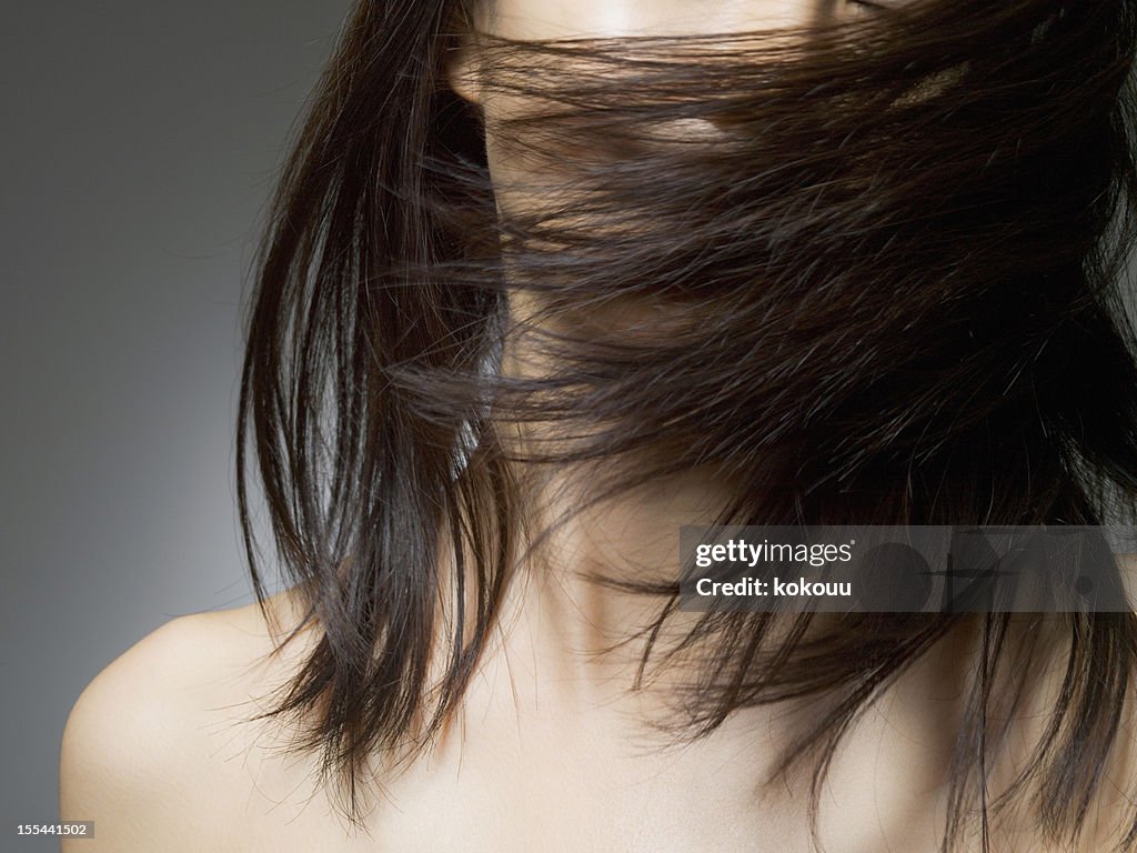 Woman covered with the hair of her