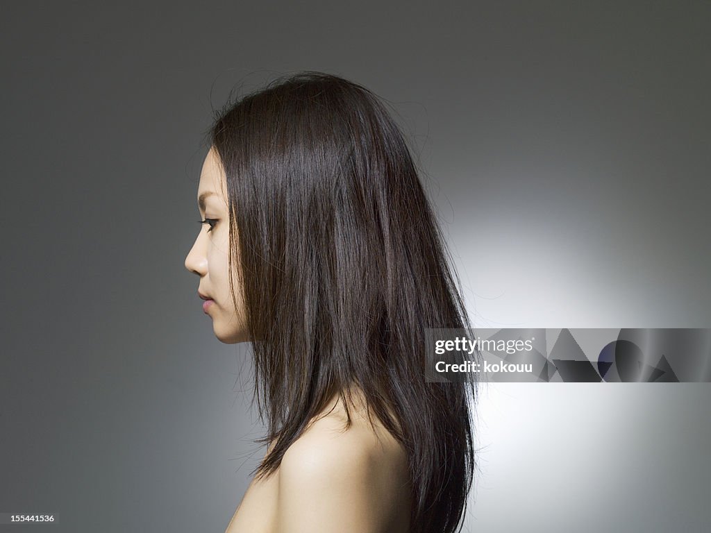 Long haired woman who turns to width