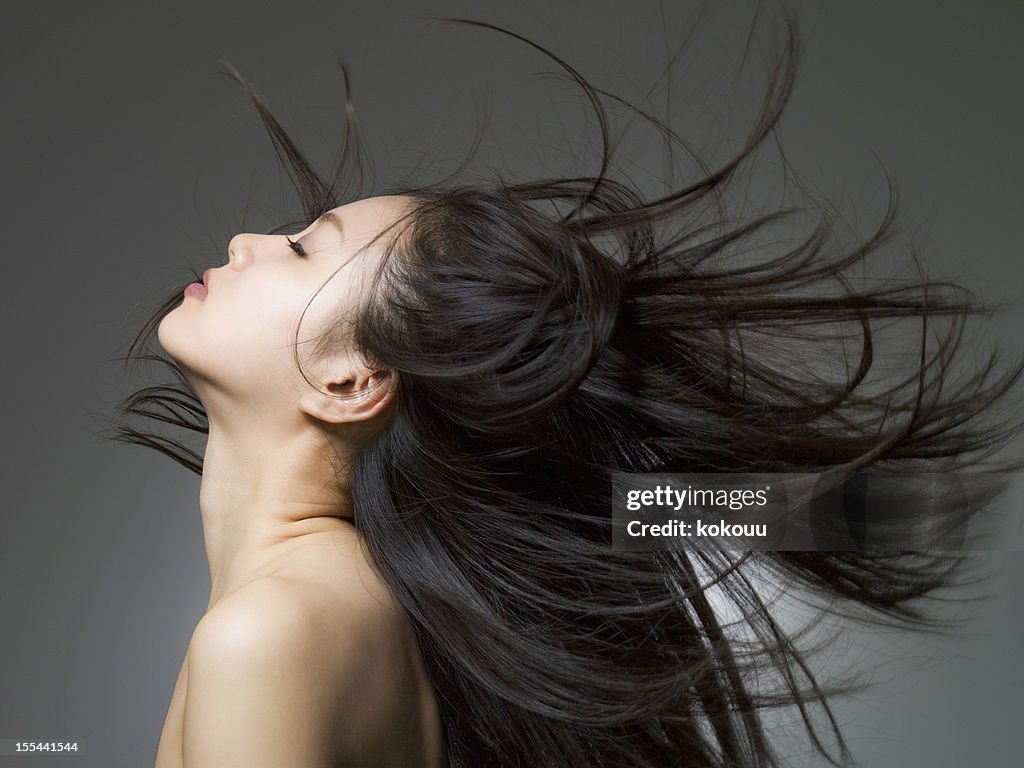 Profile shot of the woman who looks up