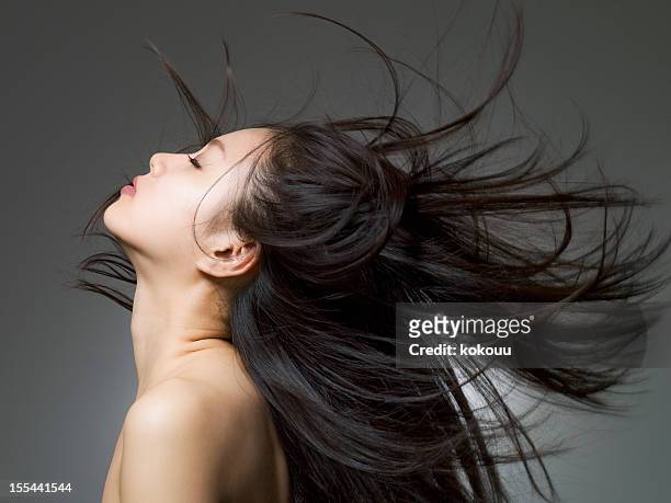 profile shot of the woman who looks up - beautiful japanese women stock pictures, royalty-free photos & images