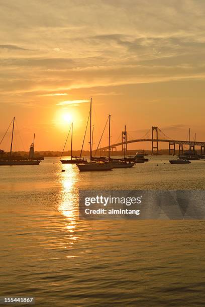 sunset at narragansett bay - rhode island bridge stock pictures, royalty-free photos & images