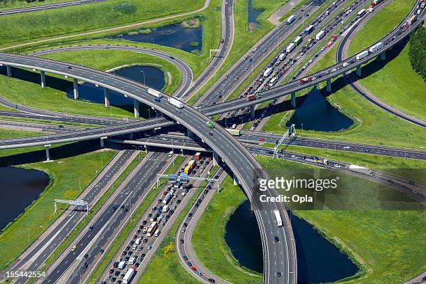 aerial shot of highway interchange - netherlands stock pictures, royalty-free photos & images
