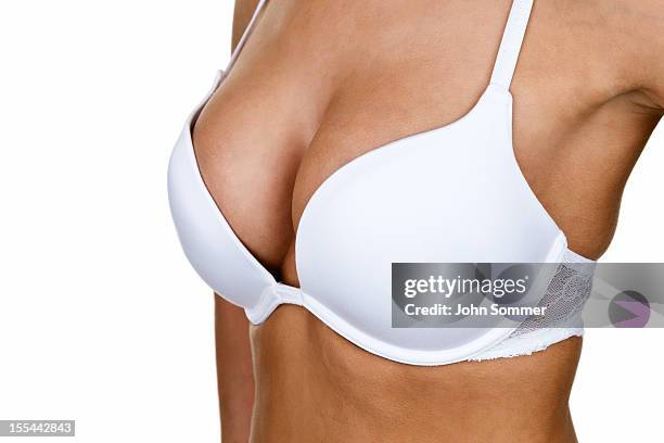 woman wearing a bra - beha stockfoto's en -beelden