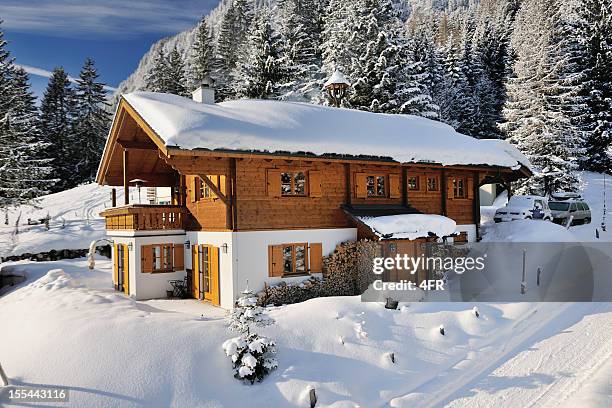 traditional ski chalet covered in snow (xxxl) - summer cottage stock pictures, royalty-free photos & images