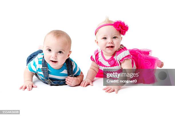 twins on their tummy - baby girl laying on tummy stock pictures, royalty-free photos & images