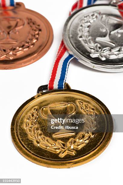 . medals isolated on white - medal podium stock pictures, royalty-free photos & images