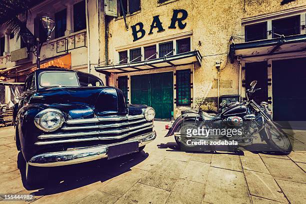 vintage car (chevrolet) and motorbike in jakarta, indonesia - stock photo car chrome bumper stock pictures, royalty-free photos & images