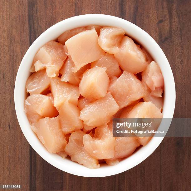 diced chicken meat - raw chicken stock pictures, royalty-free photos & images