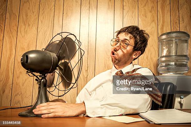 business man in office with fan - electric fan stock pictures, royalty-free photos & images