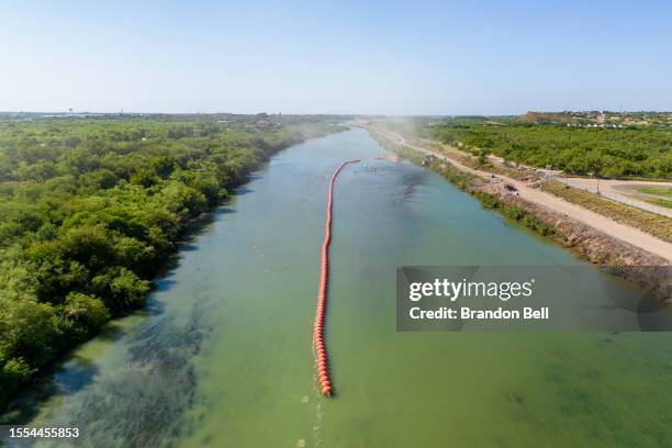 Buoy barriers are installed and situated in the middle of the Rio Grande river on July 18, 2023 in Eagle Pass, Texas. Texas has begun installing buoy...