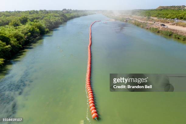 Buoy barriers are installed and situated in the middle of the Rio Grande river on July 18, 2023 in Eagle Pass, Texas. Texas has begun installing buoy...