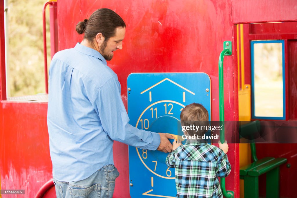 Father and Son With a Clock