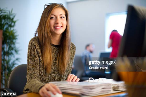 young female office worker - file clerk stock pictures, royalty-free photos & images