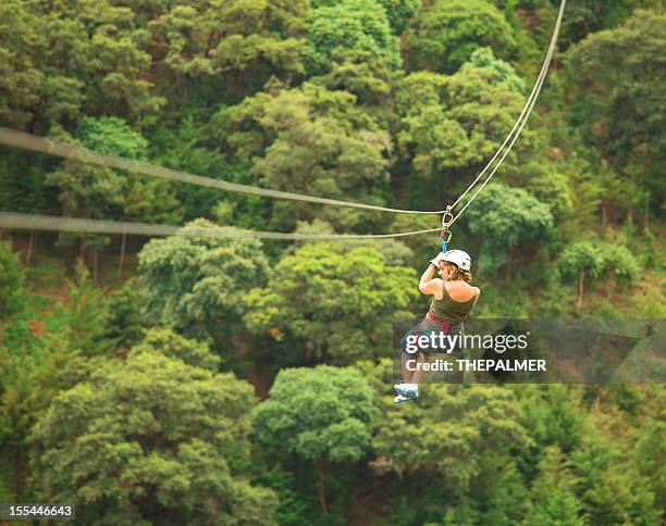 woman during a canopy tour in guatemala - zip line stockfoto's en -beelden