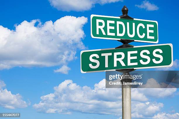 reduce stress street sign - james burden stock pictures, royalty-free photos & images