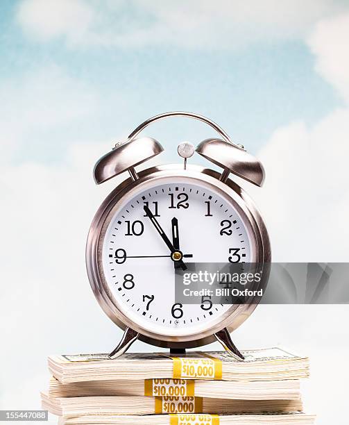 clock on money - top priority stock pictures, royalty-free photos & images