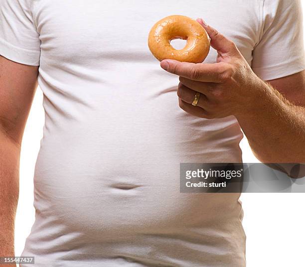 unhealthy eating - fat people eating donuts stock pictures, royalty-free photos & images
