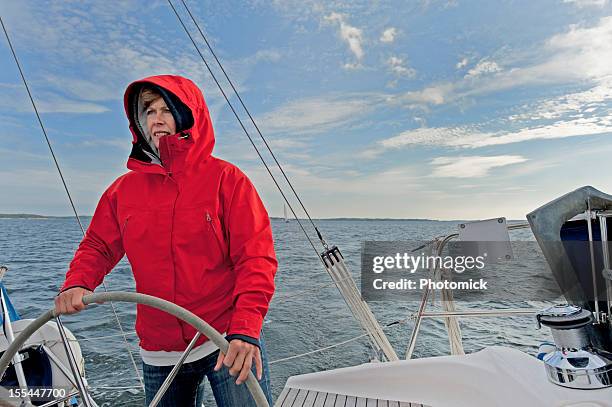 at the helm - boat helm stock pictures, royalty-free photos & images