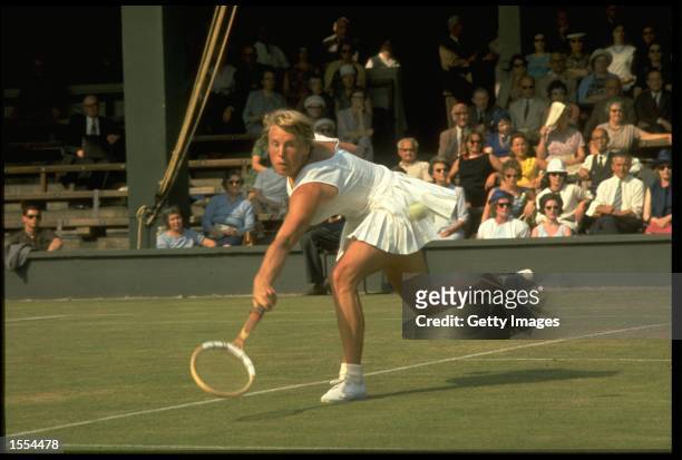 ANN JONES OF GREAT BRITAIN PLAYS A LOW SHOT DURING A MATCH AT THE 1967 WIMBLEDON TENNIS CHAMPIONSHIPS.