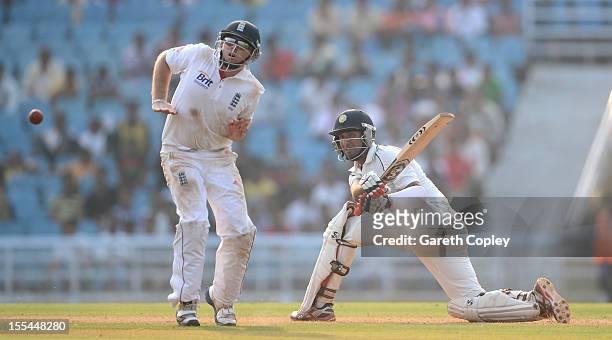 Cheteshwar Pujara of Mumbai A hits past Ian Bell of England during day two of the tour match between Mumbai A and England at The Dr D.Y. Palit Sports...