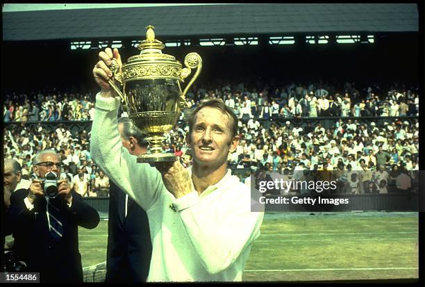 ROD LAVER OF AUSTRALIA LIFTS THE TROPHY AFTER WINNING THE MENS SINGLES TITLE AT THE 1969 WIMBLEDON TENNIS CHAMPIONSHIPS. LAVER DEFEATED JOHN NEWCOMBE...