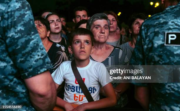 Demonstrators rally to demand the reopening of a blockaded road linking the Nagorno-Karabakh region to Armenia and to decry crisis conditions in the...