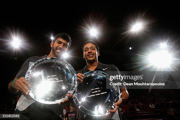 Mahesh Bhupathi and Rohan Bopanna of India pose with their trophy after victory against Aisam Ul Haq Qureshi of Pakistan and Jean Julien Rojer of...