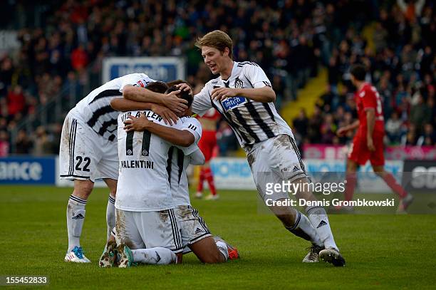 Cidimar da Silva of Aalen celebrates his team's second goal with his teammates during the Second Bundesliga match between VfR Aalen and 1. FC Koeln...