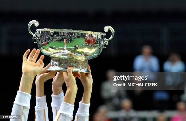 Members of the Czech Fed Cup Tennis team hold the trophy of the International Tennis Federation Fed Cup on November 4 in Prague. The Czech Republic...